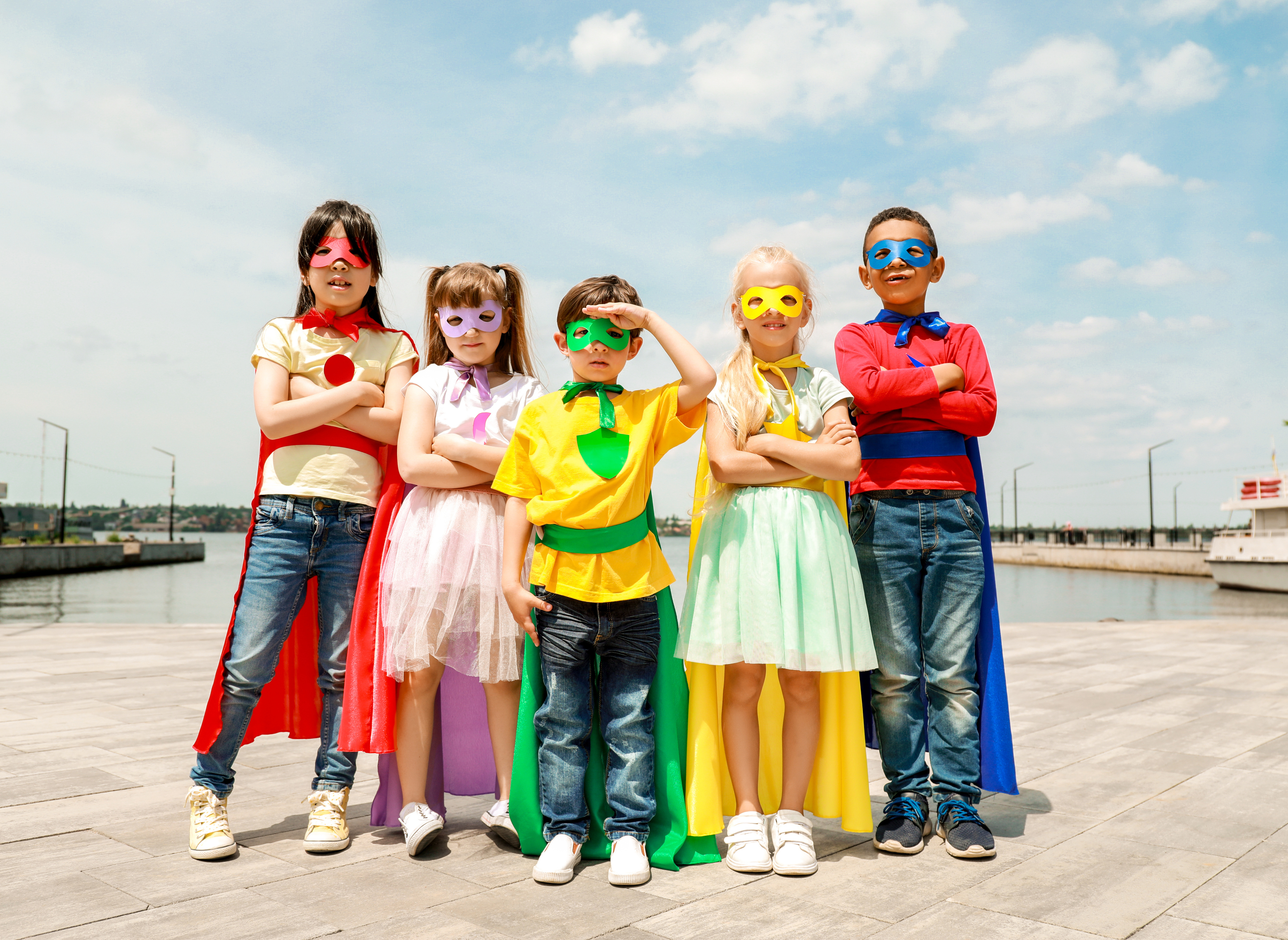 Cute Little Children Dressed as Superheroes Outdoors